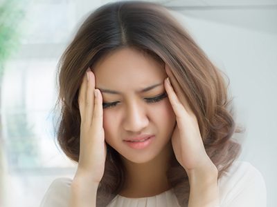 a girl feeling dizzy