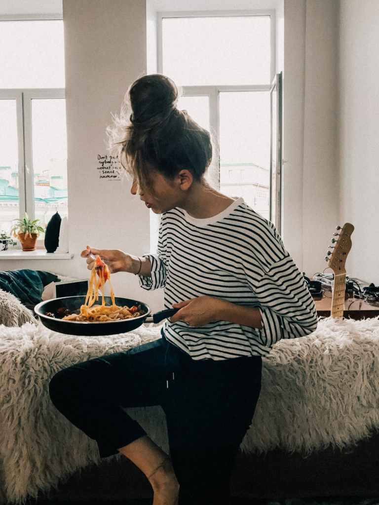 woman eating noodles